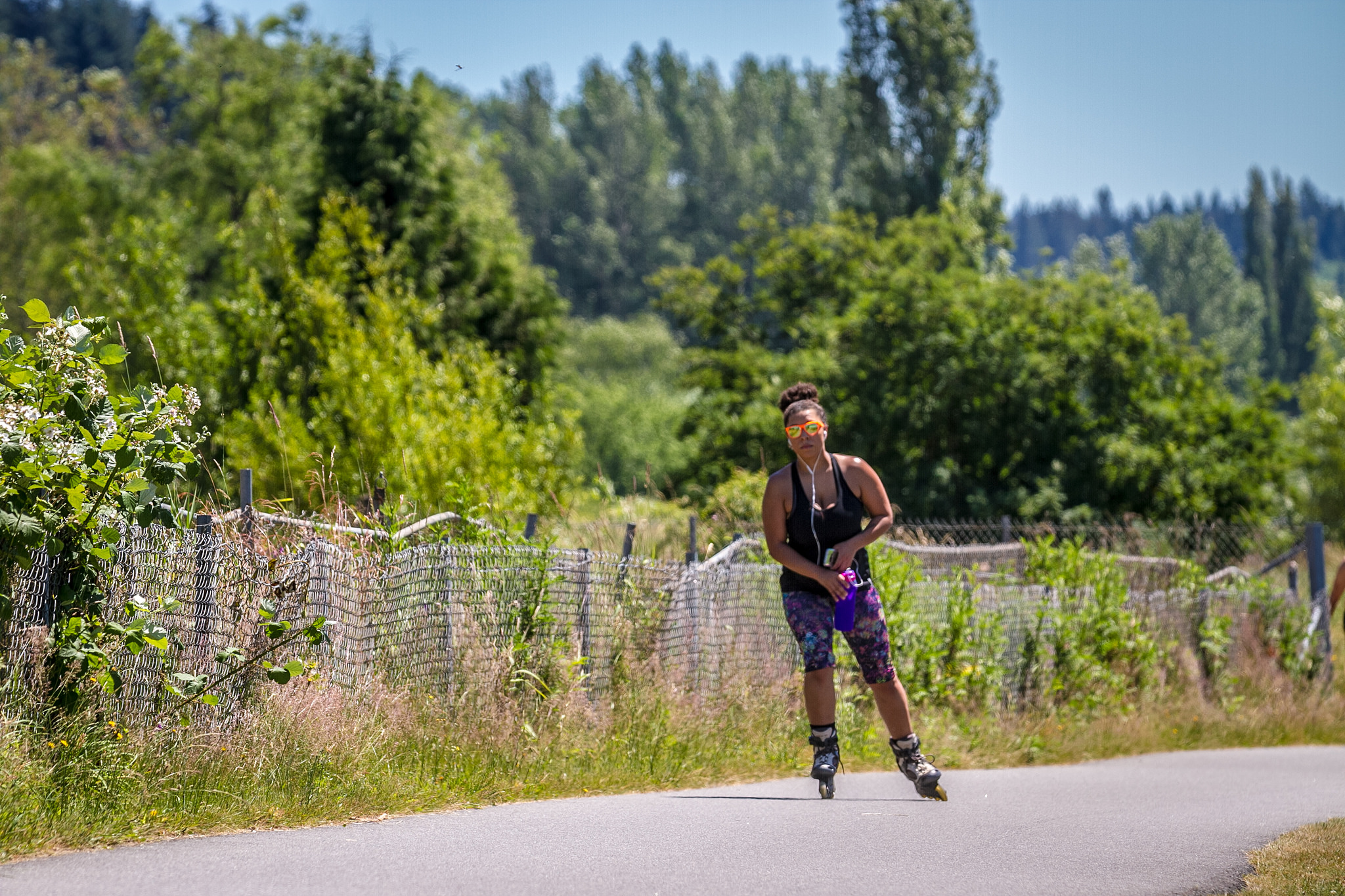 35483474901_c3ffd717b8_k Woman rollerblading on a trail